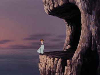 Movie still from “Peter Pan” (1953), directed by Jack Kinney – A woman standing on top of a cliff looking out over the ocean; Extreme Wide shot, High angle