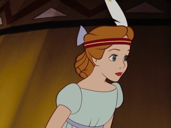Movie still from “Peter Pan” (1953), directed by Jack Kinney – A girl with a feather in her hair is standing in front; Close Up shot, Over the shoulder angle
