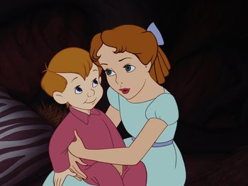 Movie still from “Peter Pan” (1953), directed by Jack Kinney – A woman and a boy are standing together; Medium shot, High angle