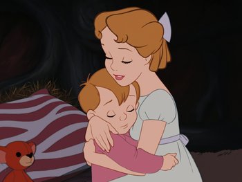 Movie still from “Peter Pan” (1953), directed by Jack Kinney – A woman and a child hugging each other in front of a black background; Medium shot, High angle