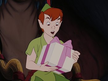 Movie still from “Peter Pan” (1953), directed by Jack Kinney – A person holding a gift box in front of a wall; Medium shot, High angle