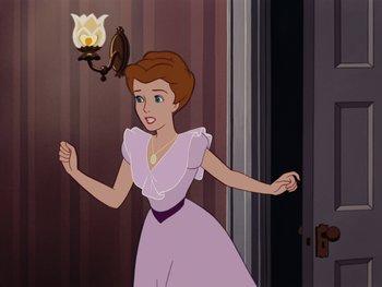 Movie still from “Peter Pan” (1953), directed by Jack Kinney – A woman in a purple dress is looking at a candle; Medium shot, Over the shoulder angle