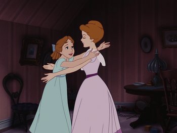 Movie still from “Peter Pan” (1953), directed by Jack Kinney – Two animated girls hugging each other in a living room; Medium shot, High angle