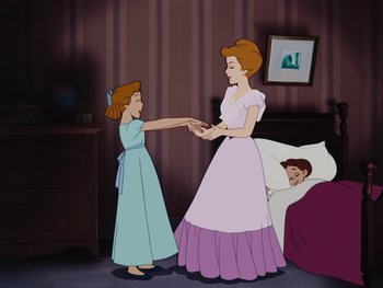 Movie still from “Peter Pan” (1953), directed by Jack Kinney – An animated scene of a woman and a child; Medium shot, High angle