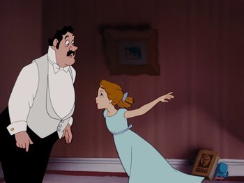 Movie still from “Peter Pan” (1953), directed by Jack Kinney – A man and a woman are in a room; Medium shot, Over the shoulder angle
