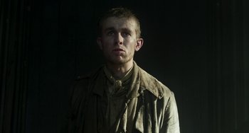 Movie still from “Peterloo” (2018), directed by Mike Leigh – A man in a military uniform is looking at the camera; Medium shot, Low angle