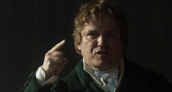 Movie still from “Peterloo” (2018), directed by Mike Leigh – A person pointing at something; Close Up shot, Low angle