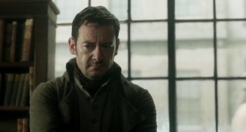 Movie still from “Peterloo” (2018), directed by Mike Leigh – A person wearing a jacket; Close Up shot, Over the shoulder angle