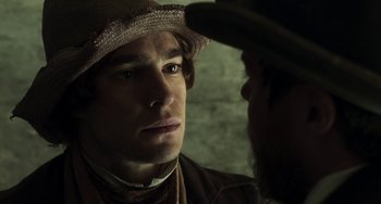 Movie still from “Peterloo” (2018), directed by Mike Leigh – A person wearing a hat; Close Up shot, Over the shoulder angle