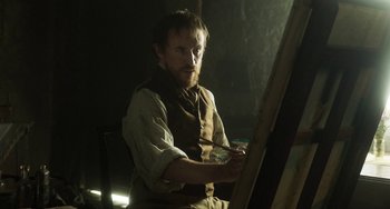 Movie still from “Peterloo” (2018), directed by Mike Leigh – A man with a beard is holding a paintbrush; Medium shot, Low angle