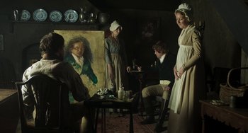 Movie still from “Peterloo” (2018), directed by Mike Leigh – A group of people standing around a painting; Wide shot, Over the shoulder angle
