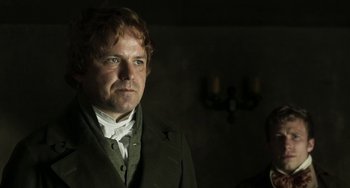 Movie still from “Peterloo” (2018), directed by Mike Leigh – A person wearing a suit and tie; Close Up shot, Low angle