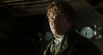 Movie still from “Peterloo” (2018), directed by Mike Leigh – A man in a green jacket looking to his left; Close Up shot, Low angle