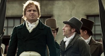 Movie still from “Peterloo” (2018), directed by Mike Leigh – A group of men in top hats standing next to each other; Medium shot, Low angle