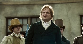 Movie still from “Peterloo” (2018), directed by Mike Leigh – A man standing in front of other people; Medium shot, Low angle