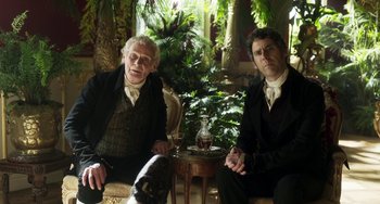 Movie still from “Peterloo” (2018), directed by Mike Leigh – Two men sitting next to each other in a room; Medium shot, Low angle
