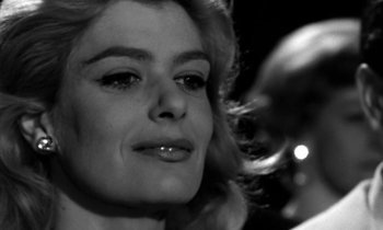 Movie still from “Phaedra” (1962), directed by Jules Dassin – A woman's face in a black and white photo; Close Up shot, Low angle