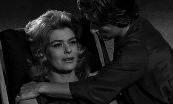Movie still from “Phaedra” (1962), directed by Jules Dassin – A man and a woman in a black and white photo; Close Up shot, Over the shoulder angle