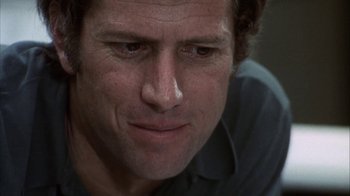 Movie still from “Phase IV” (1974), directed by Saul Bass – A man's face with a lot of wrinkles on his face; Close Up shot, Low angle