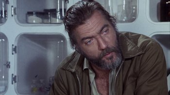 Movie still from “Phase IV” (1974), directed by Saul Bass – A person with a beard; Close Up shot, Over the shoulder angle