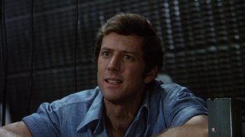 Movie still from “Phase IV” (1974), directed by Saul Bass – A person wearing a blue shirt; Close Up shot, Low angle