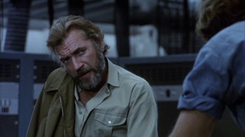 Movie still from “Phase IV” (1974), directed by Saul Bass – A person with a beard; Close Up shot, Over the shoulder angle