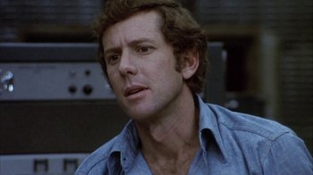 Movie still from “Phase IV” (1974), directed by Saul Bass – A person wearing a blue shirt; Close Up shot, Low angle