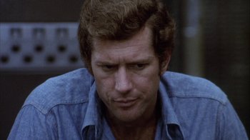 Movie still from “Phase IV” (1974), directed by Saul Bass – A person wearing a blue shirt; Close Up shot, High angle