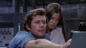 Movie still from “Phase IV” (1974), directed by Saul Bass – A man and a woman looking at each other; Close Up shot, Low angle