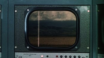 Movie still from “Phase IV” (1974), directed by Saul Bass – A view of a cloudy sky through a television screen; Extreme Wide shot, High angle