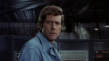 Movie still from “Phase IV” (1974), directed by Saul Bass – A person wearing a blue shirt; Close Up shot, Low angle