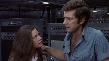 Movie still from “Phase IV” (1974), directed by Saul Bass – A man and a woman are looking at each other; Close Up shot, Over the shoulder angle