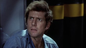 Movie still from “Phase IV” (1974), directed by Saul Bass – A person wearing a blue shirt; Close Up shot, Low angle