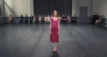 Movie still from “Pina” (2011), directed by Wim Wenders – A woman standing in front of a group of people; Wide shot, High angle