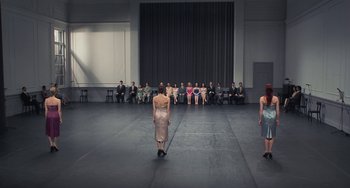 Movie still from “Pina” (2011), directed by Wim Wenders – A group of people sitting in a room watching a performance; Wide shot, High angle