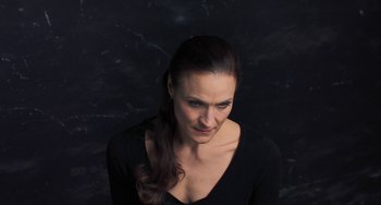 Movie still from “Pina” (2011), directed by Wim Wenders – A person wearing a black shirt; Close Up shot, High angle