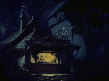 Movie still from “Pinocchio” (1940), directed by Jack Kinney – A painting of a scene in a dark place; Wide shot, Low angle