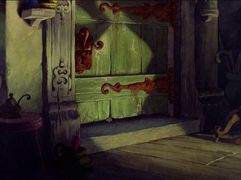Movie still from “Pinocchio” (1940), directed by Jack Kinney – A painting of an open green door in a room; Wide shot, High angle