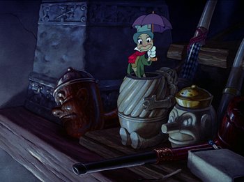 Movie still from “Pinocchio” (1940), directed by Jack Kinney – A painting of an elf holding an umbrella; Wide shot, Low angle