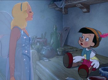 Movie still from “Pinocchio” (1940), directed by Jack Kinney – A woman in a blue dress is looking at pinocchio; Medium shot, Over the shoulder angle