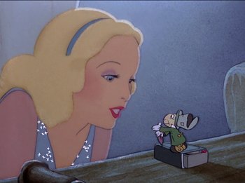 Movie still from “Pinocchio” (1940), directed by Jack Kinney – A painting of a woman looking at a mouse; Medium shot, Low angle