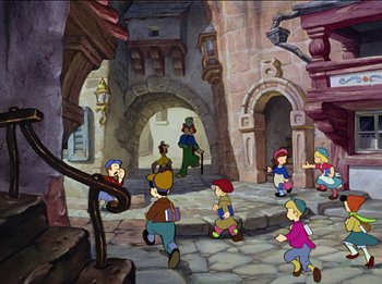 Movie still from “Pinocchio” (1940), directed by Jack Kinney – A group of children are playing a game in the middle of the street; Wide shot, High angle