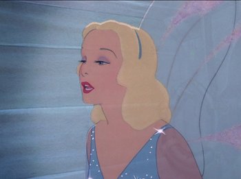 Movie still from “Pinocchio” (1940), directed by Jack Kinney – A woman with blonde hair and a blue dress; Close Up shot, Over the shoulder angle