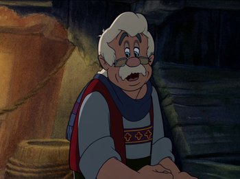 Movie still from “Pinocchio” (1940), directed by Jack Kinney – An old man with white hair and a beard; Medium shot, Over the shoulder angle