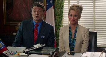 Movie still from “Pitch Perfect 2” (2015), directed by Elizabeth Banks – A man and a woman sitting at a table; Medium shot, Over the shoulder angle