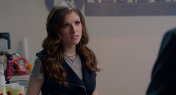 Movie still from “Pitch Perfect 2” (2015), directed by Elizabeth Banks – A beautiful young woman with long brown hair; Close Up shot, Over the shoulder angle
