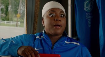 Movie still from “Pitch Perfect 2” (2015), directed by Elizabeth Banks – A woman with a bandage on her head is looking surprised; Close Up shot, Over the shoulder angle