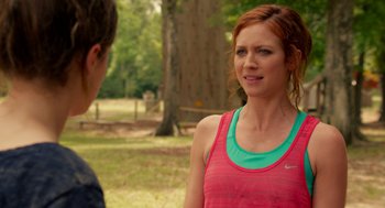Movie still from “Pitch Perfect 2” (2015), directed by Elizabeth Banks – A woman in a pink shirt talking to a man in a green shirt; Close Up shot, Over the shoulder angle