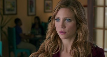 Movie still from “Pitch Perfect 3” (2017), directed by Trish Sie – A person with long hair; Close Up shot, Over the shoulder angle
