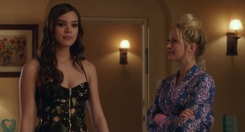 Movie still from “Pitch Perfect 3” (2017), directed by Trish Sie – Two women standing next to each other in front of a door; Medium shot, Over the shoulder angle